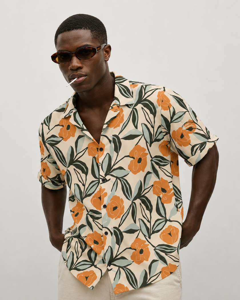 Man wearing a floral patterned shirt against a plain background